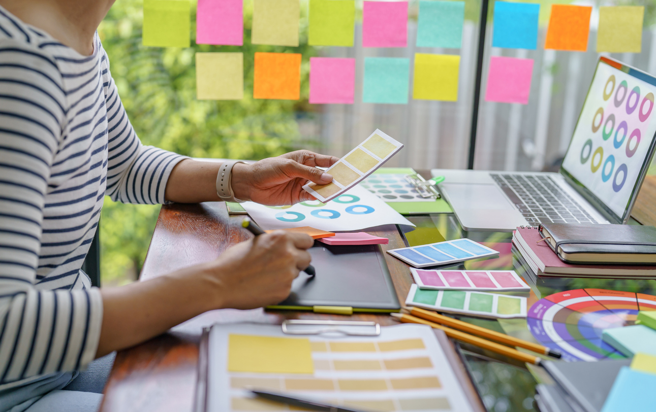 businesswoman looking at color swatches
