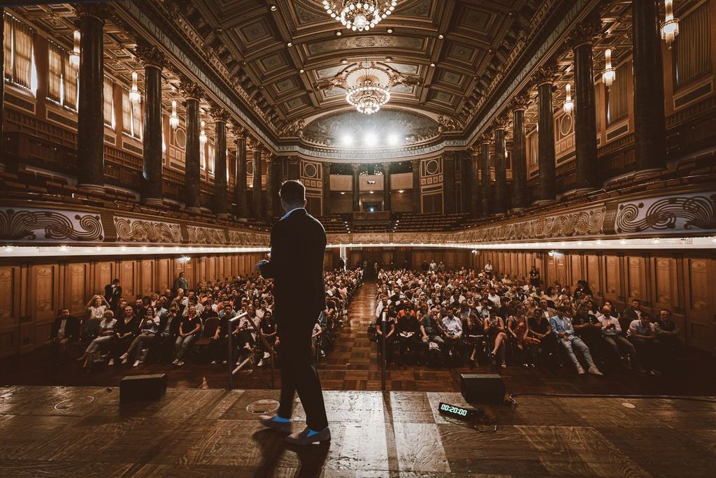Matthew Thayer speaking to an audience of his students.