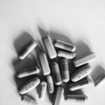 Photo by Anna Tarazevich: https://www.pexels.com/photo/a-grayscale-photo-of-medication-pills-7904443/