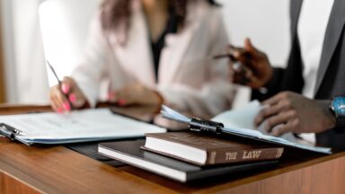 Photo by Mikhail Nilov: https://www.pexels.com/photo/law-book-in-a-podium-8730785/