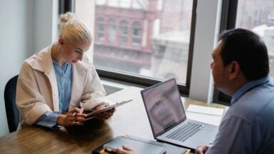 Photo by Sora Shimazaki: https://www.pexels.com/photo/serious-young-woman-reading-report-to-colleague-in-contemporary-workspace-5668853/