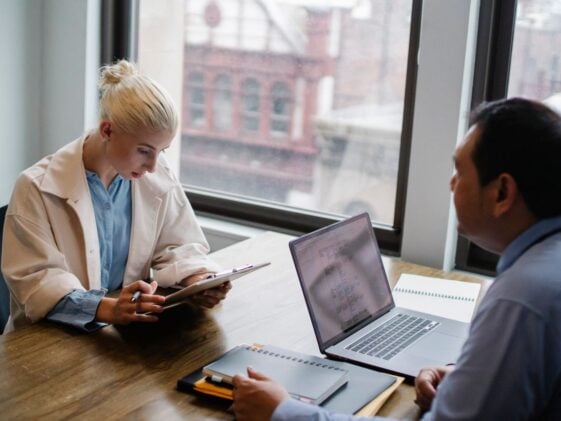 Photo by Sora Shimazaki: https://www.pexels.com/photo/serious-young-woman-reading-report-to-colleague-in-contemporary-workspace-5668853/